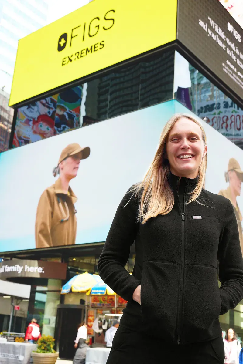 Chloe in Times Square in front of her billboard