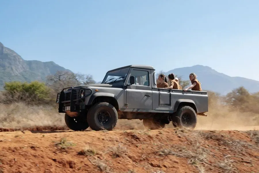 The team in a Land Rover on the reserve