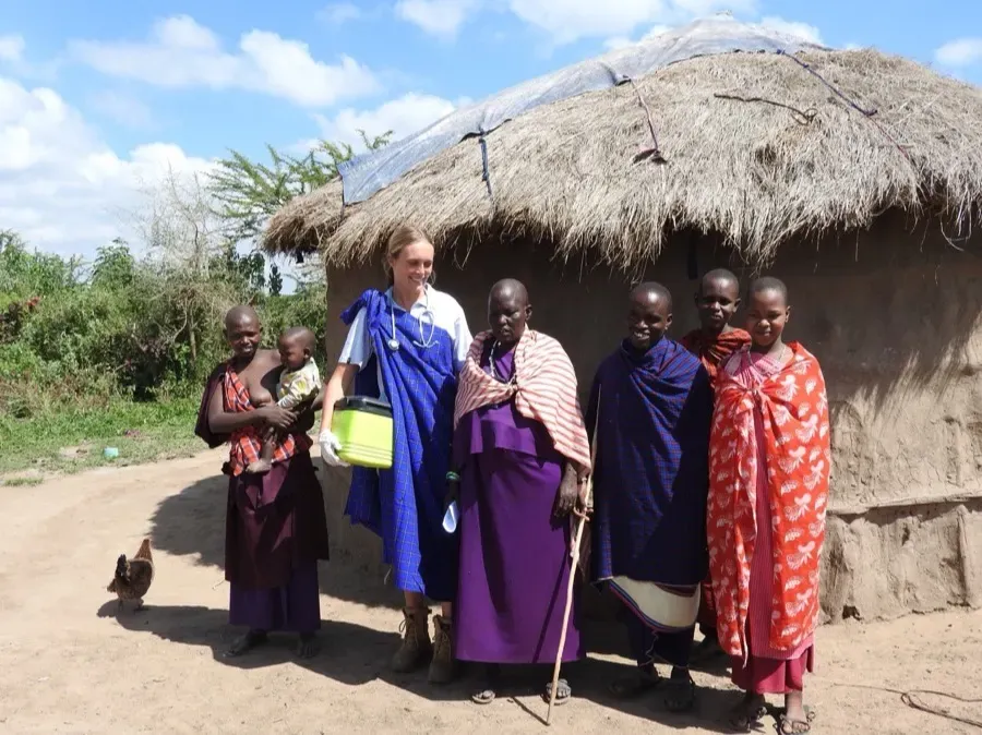 Chloe with a community during rural vet work in Africa